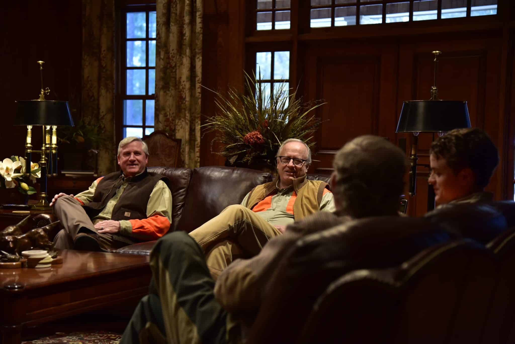 men talking in lounge at Riverview Plantation