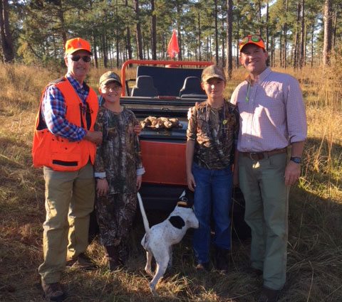 Cader Cox III with his grandsons, Keaton and Nate, and son-in-law, Cliff