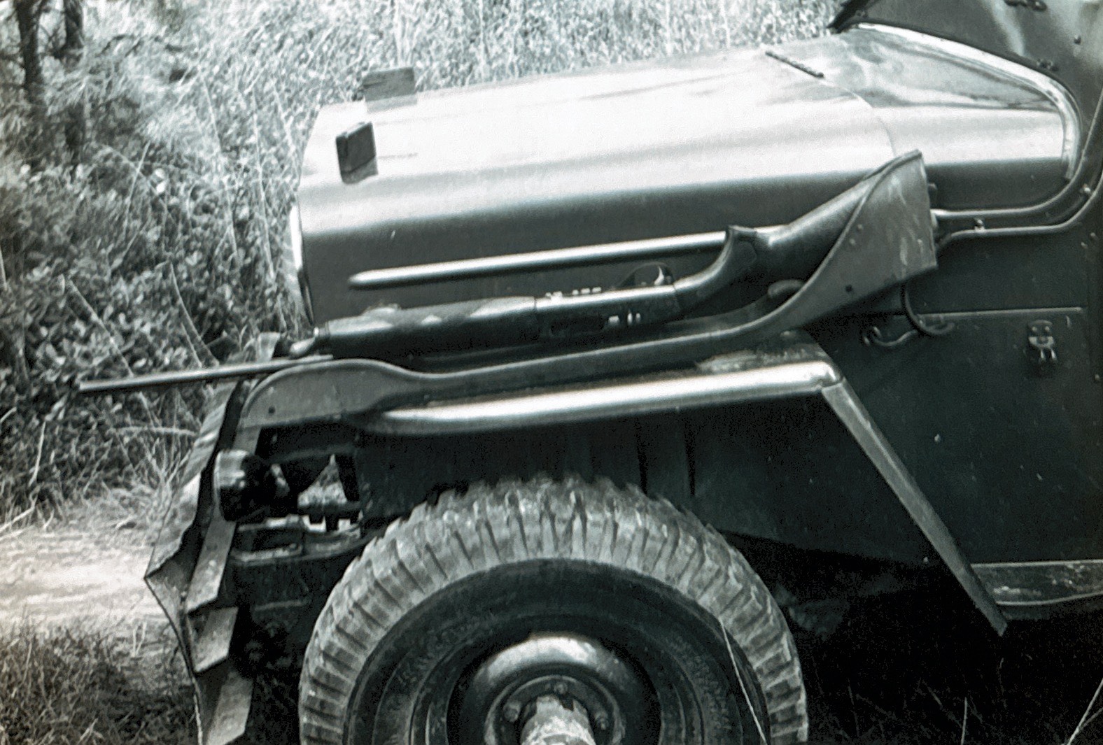 old image of a jeep with a gun holder on the side