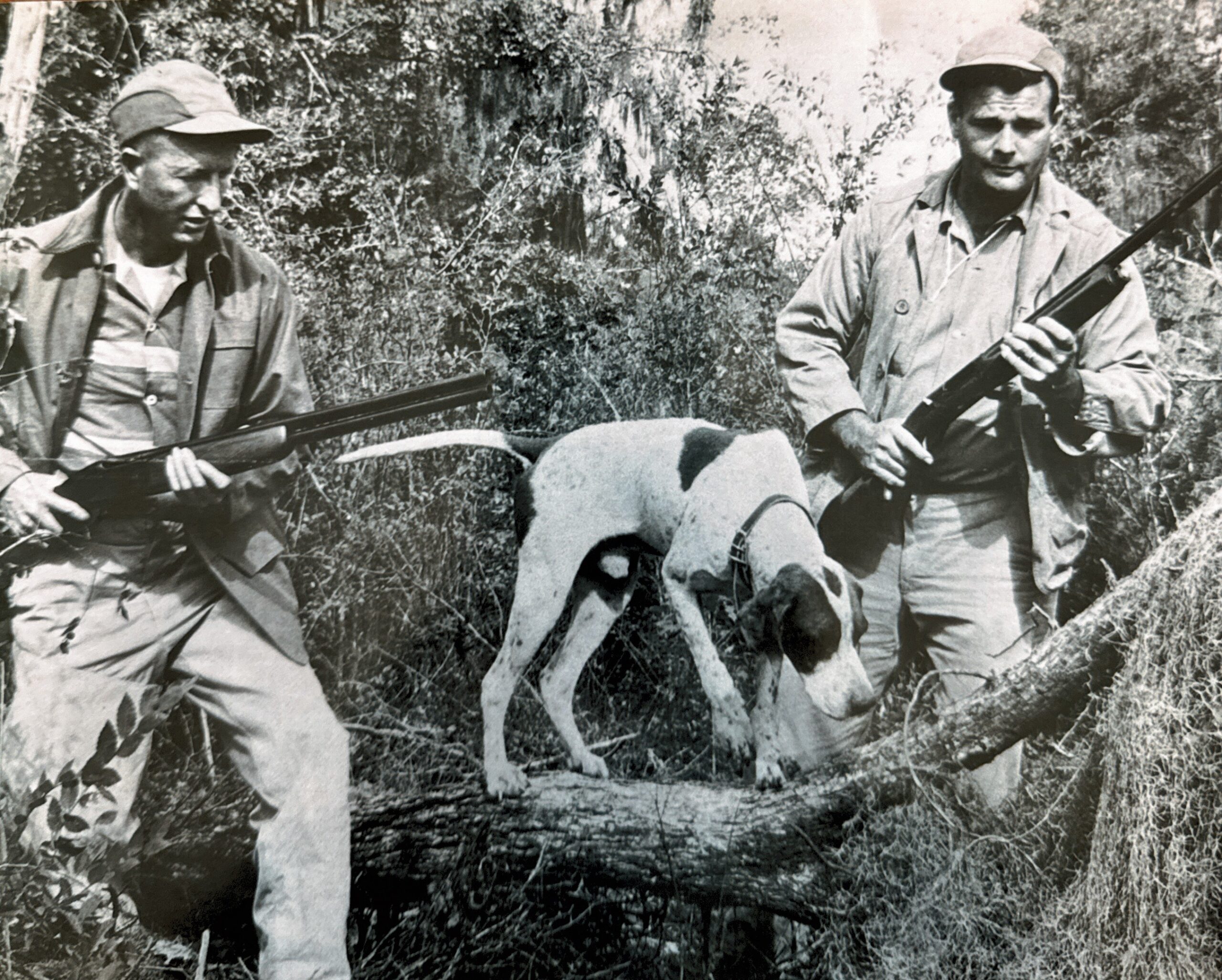 old image of two hunters and a dog